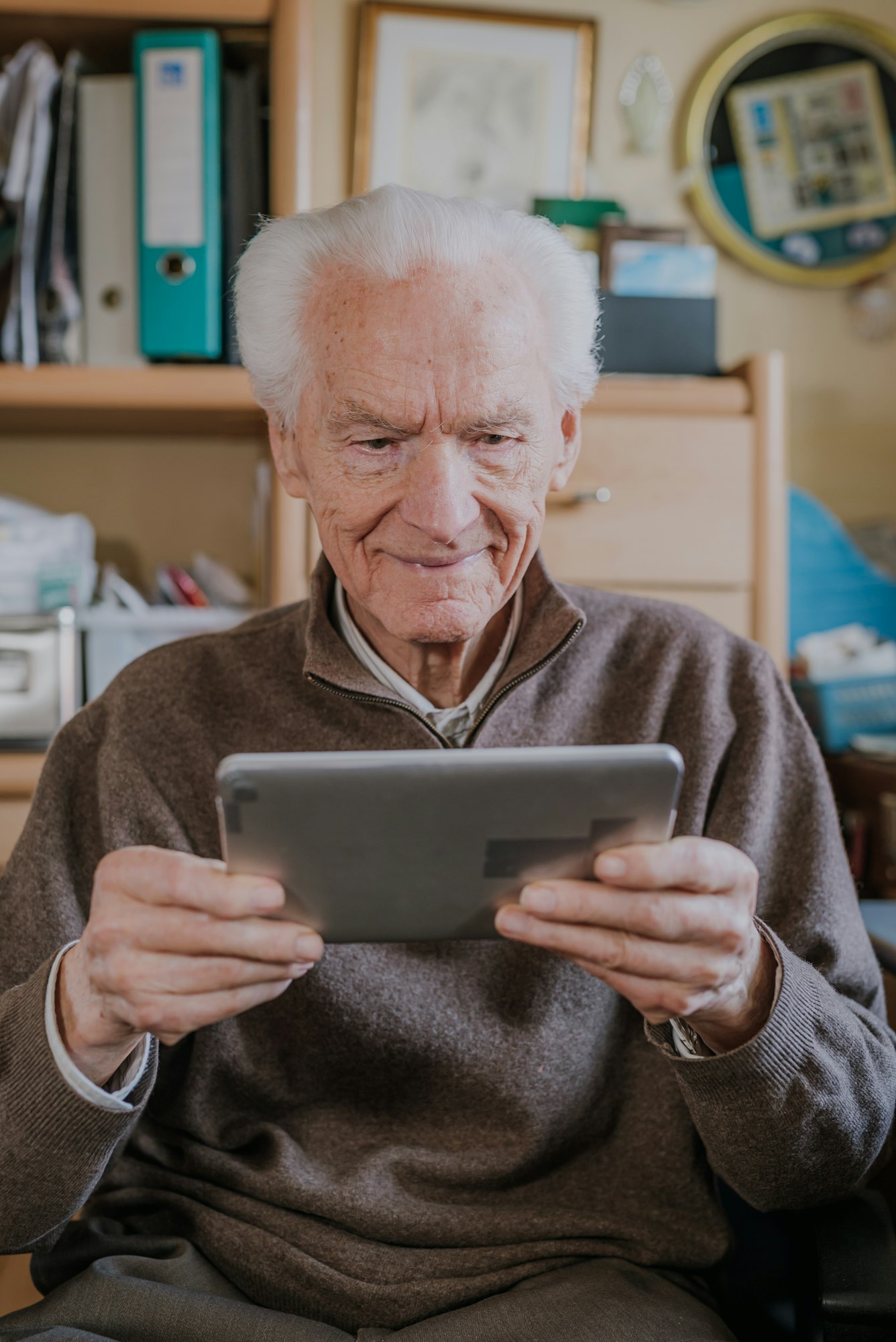 Positive Senior using Digital Tablet